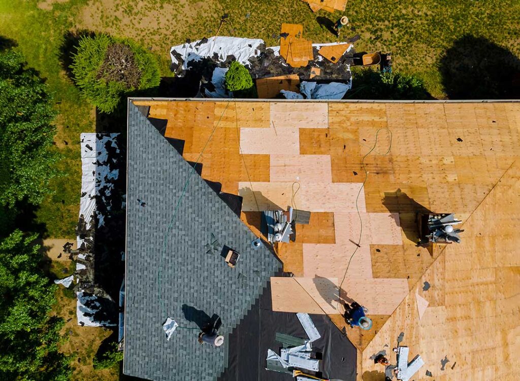 Rain falling on a residential roof above an insulated attic and quiet bedroom ceiling.