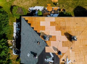 Rain falling on a residential roof above an insulated attic and quiet bedroom ceiling.